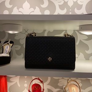 Tory Burch black leather small single flap bag.